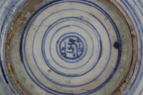 A Persian blue and white dish, Safavid, 17th century, 35cm, rim chips, restored
